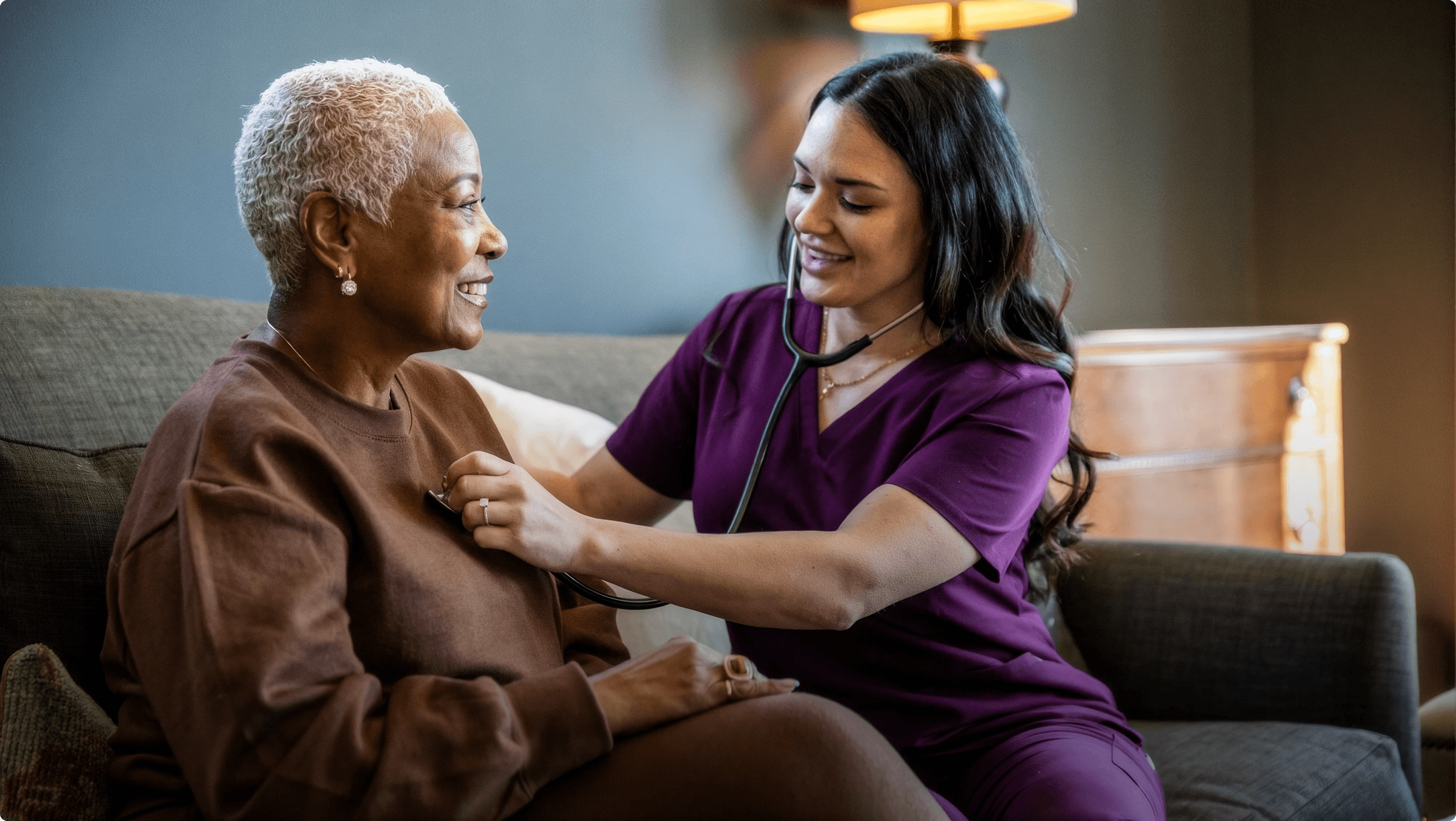 Caregiver supporting an older adult at home